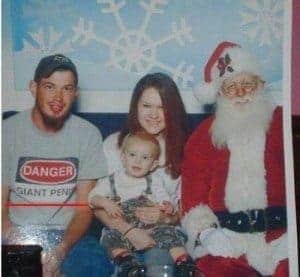 man wearing inappropriate shirt in family christmas shot