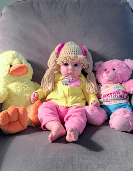 Cabbage patch kid with toys