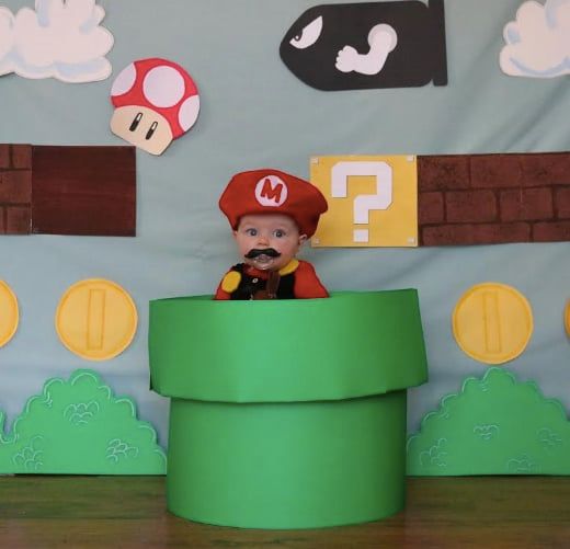 baby dressed as Mario video game