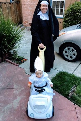 mom dressed as nun with baby dressed as pope