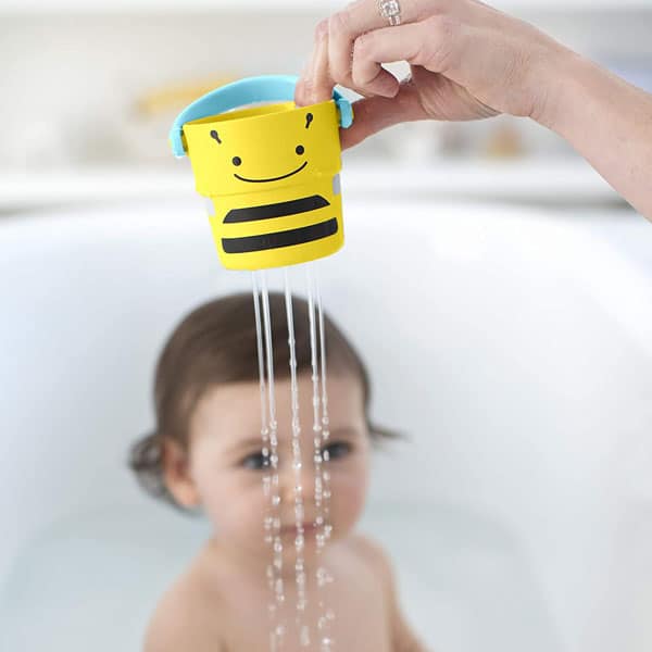 baby watching Skip hop bucket mold free bath toy drain water