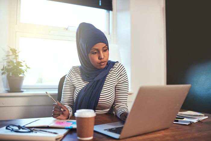 copywriter working at home on her laptop