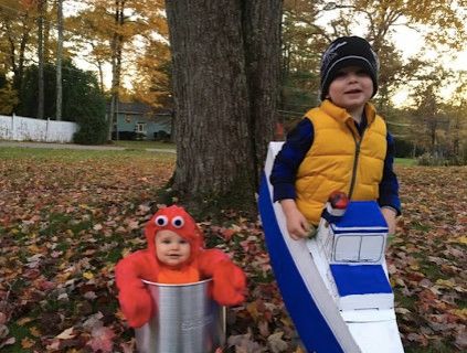 baby dressed as lobster with older brother as boat captain