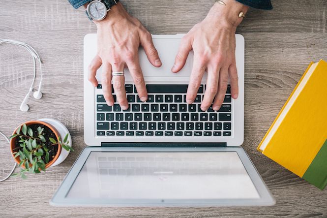 hands entering data on a computer