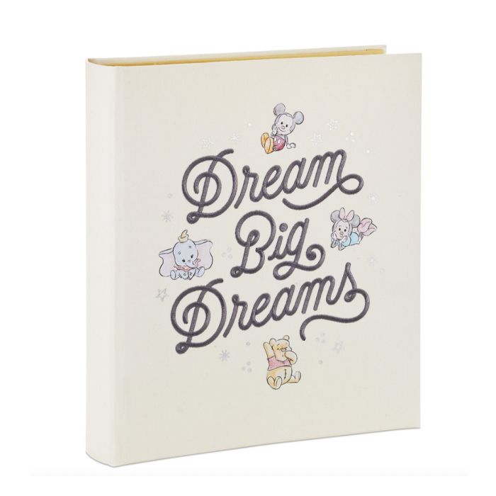 Ivory baby book cover with text, "Dream Big Dreams", and four classic Disney characters: Mickey and Minnie, Dumbo and Winnie the Pooh