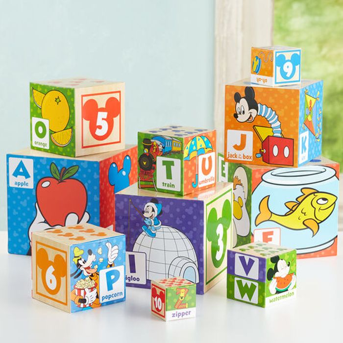 Collection of colorful cardboard stacking blocks featuring Disney characters, numbers, and letters.