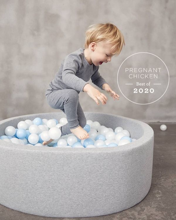 toddler jumping in gray Kidkii Ball Pit