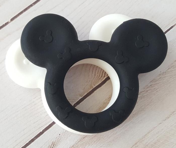 Black and white silicone baby tethers in the shape of Mickey's head