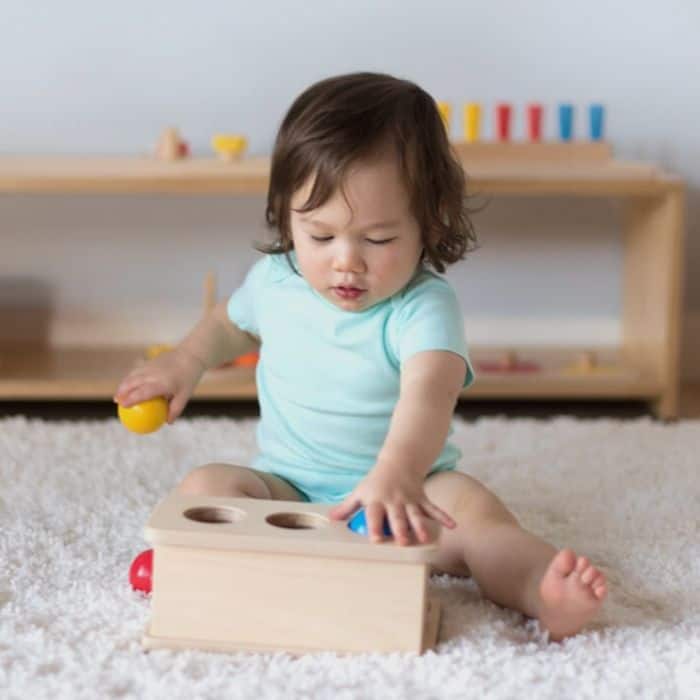 Baby playing with toy from baby subscription box