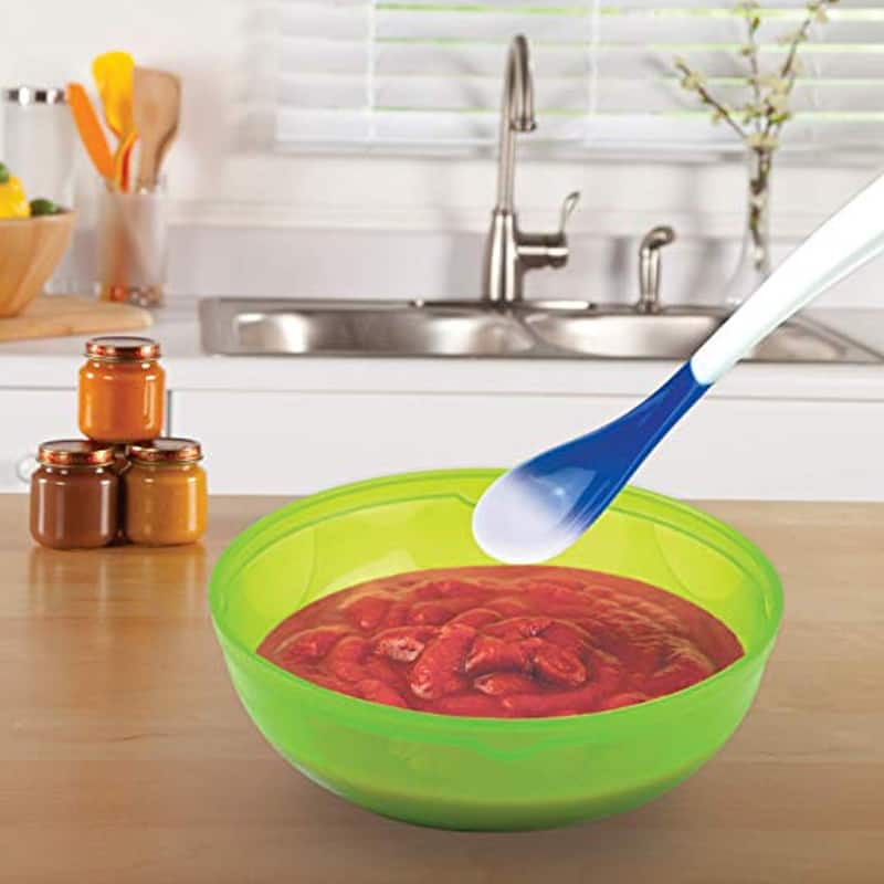heat detecting baby spoon stirring bowl of pureed red fruit