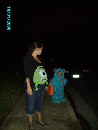 Pregnant woman dressed in a Monster's Inc costume