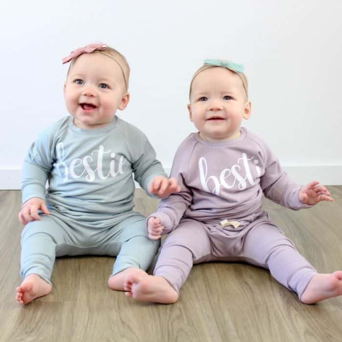 two babies wearing 'bestie' pajamas from Posh & Cozy