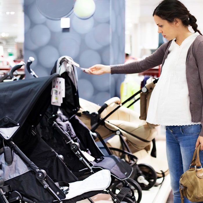 pregnant woman shopping for baby strollers from the stroller quiz