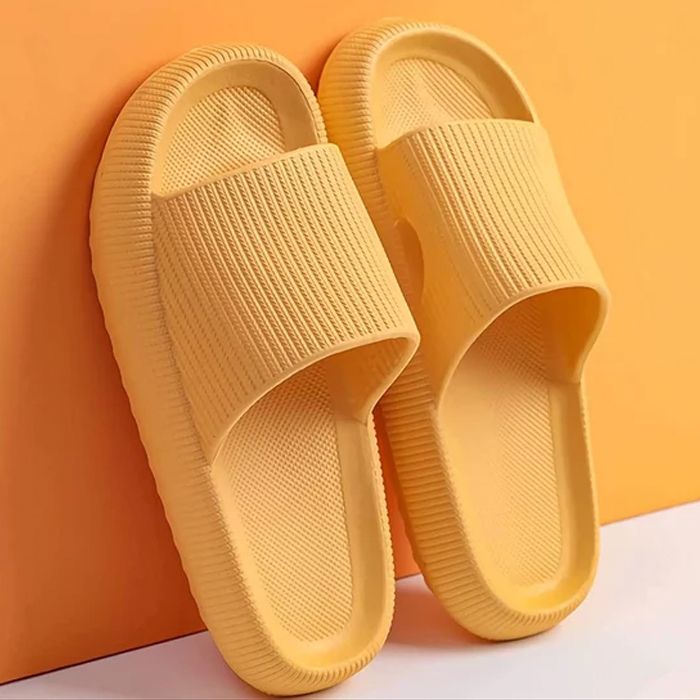 orange pillow slides leaning on a wall