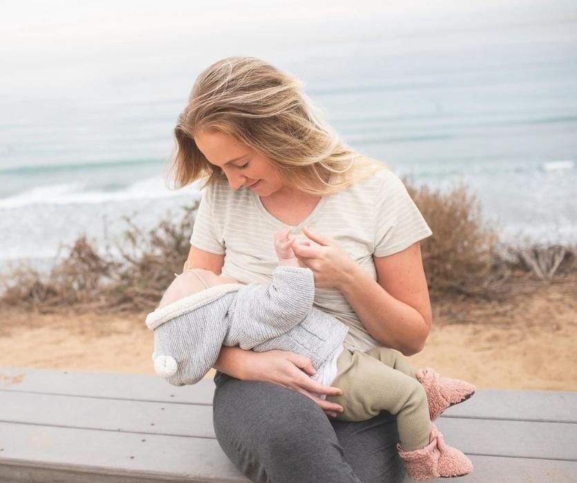 Woman breastfeeding baby in Everyday Mat & Nursing Tee