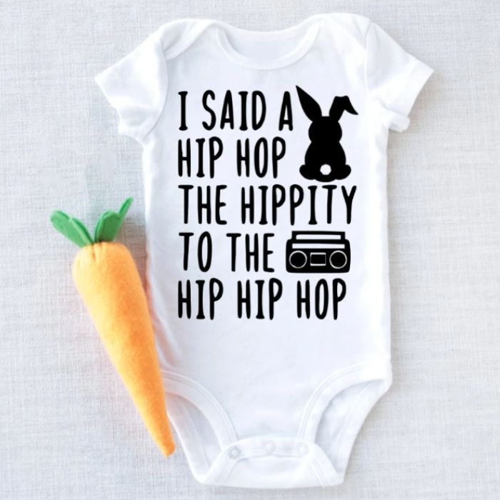 hip hop baby onesie with carrot next to it